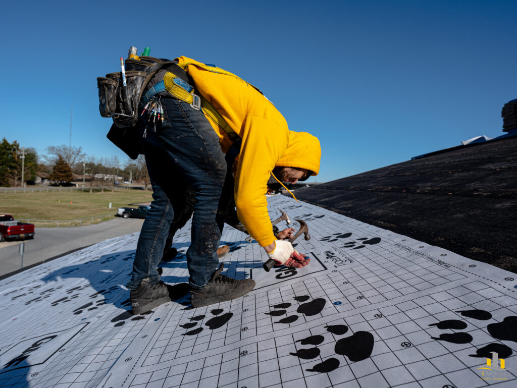 Seaford Elementary School G and Bros Roofing Employee installing GAF FeltBuster underlayment over the plywood deck .
G and Bros Roofing, your local roofing contractor based out of Salisbury MD